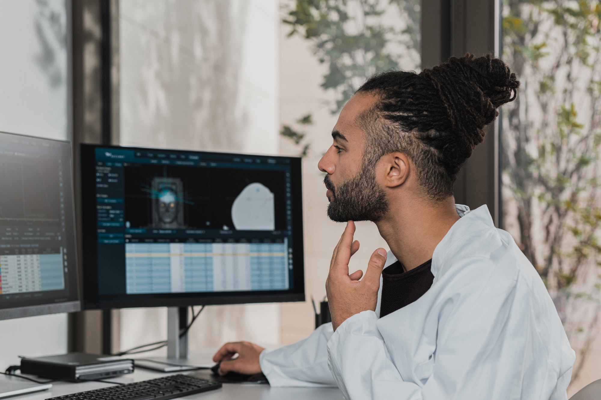 medical-technician-viewing-patient-results-on-computer