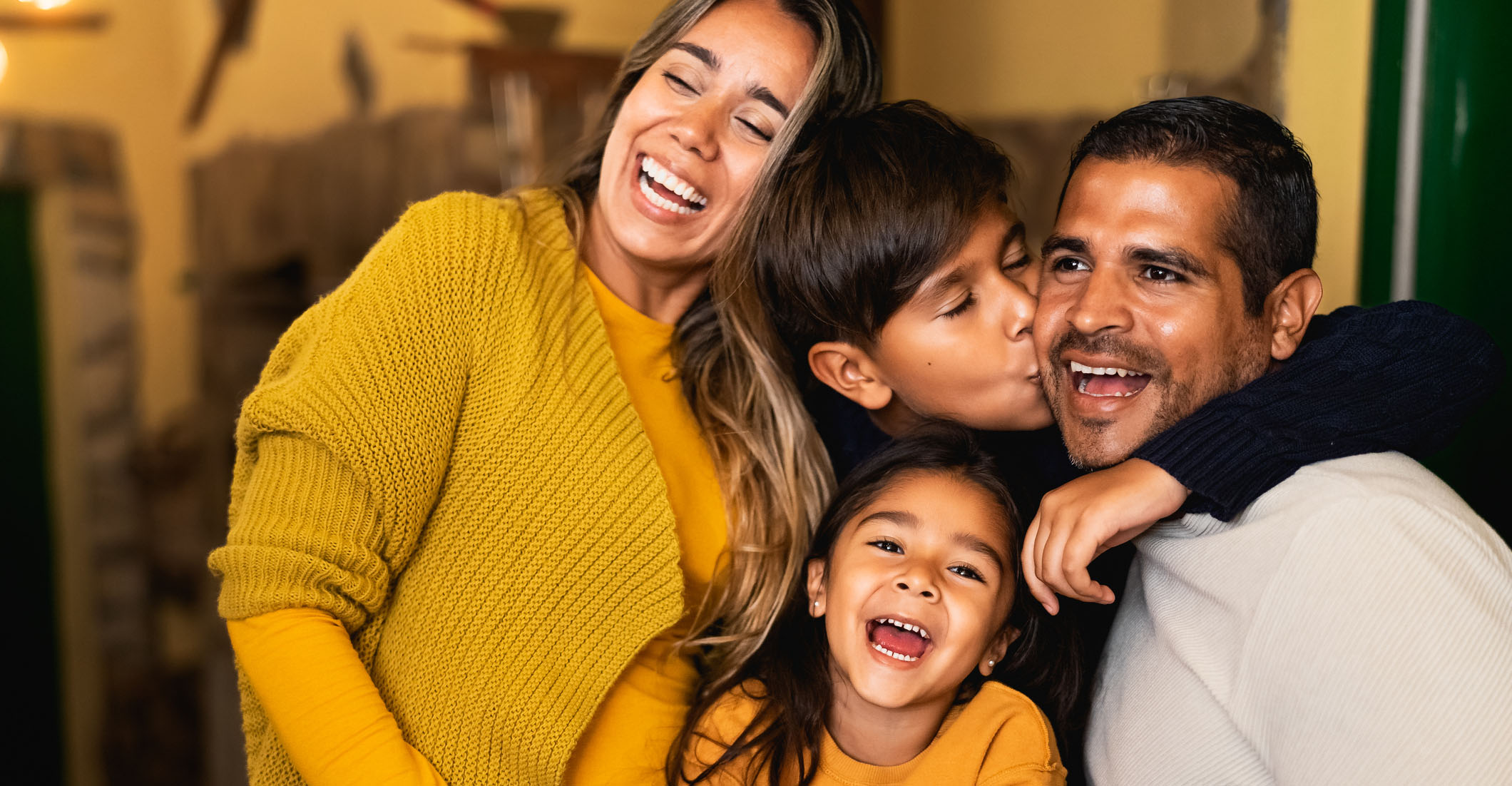 Happy Hispanic family having fun together