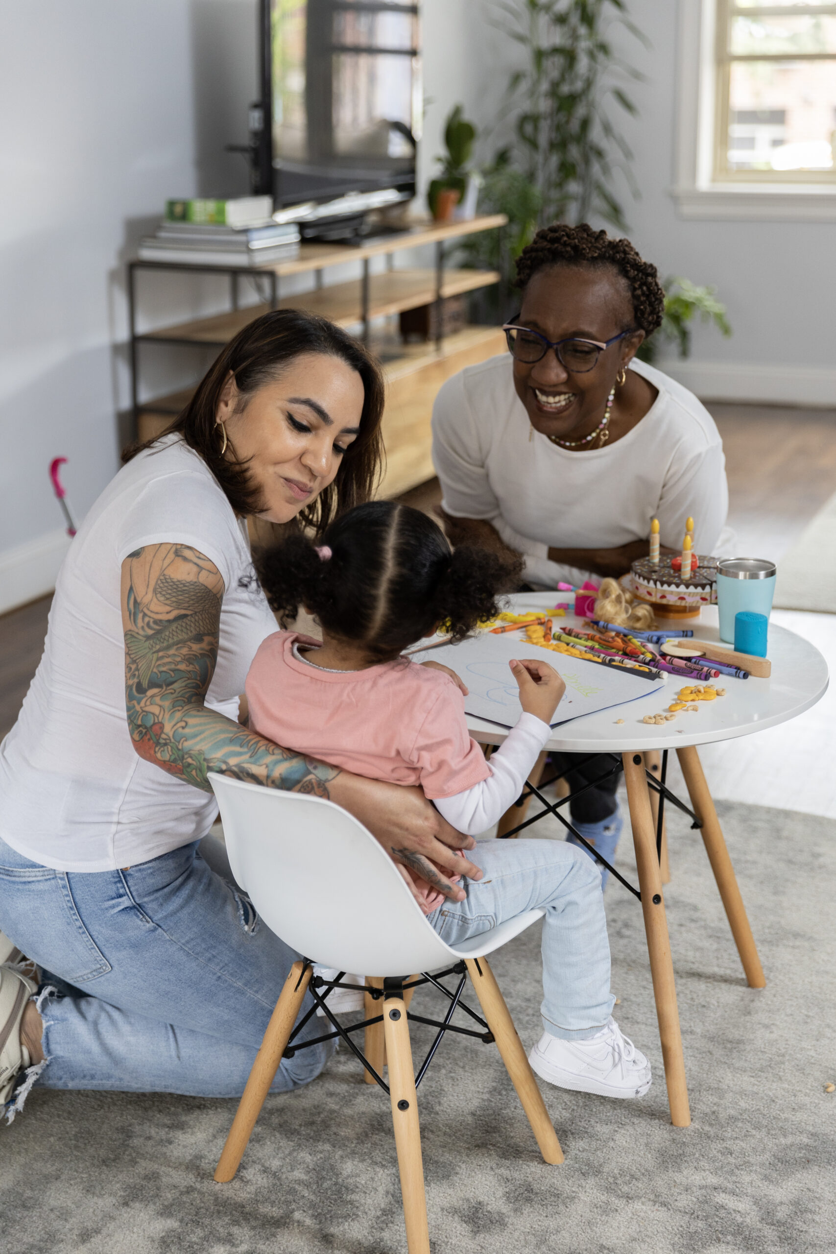 Smiling child with parent enjoying outdoor play, representing Child Health Plus coverage