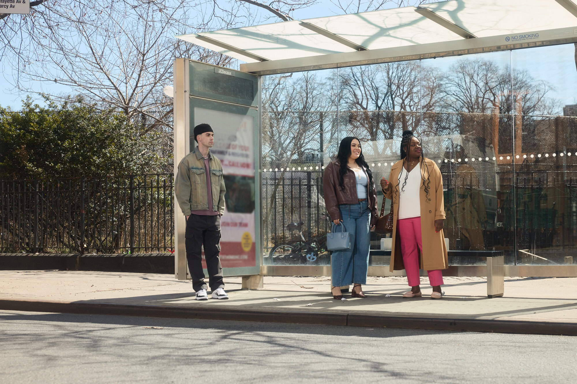 MetroPlusHealth member going out after making a health insurance payment using a mobile device.