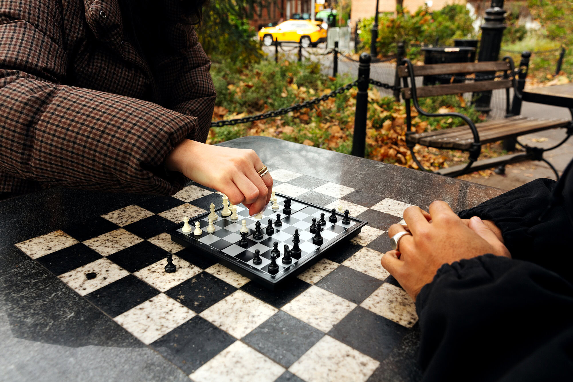 MetroPlusHealth member smiling while holding a gift card as part of the Member Rewards program.