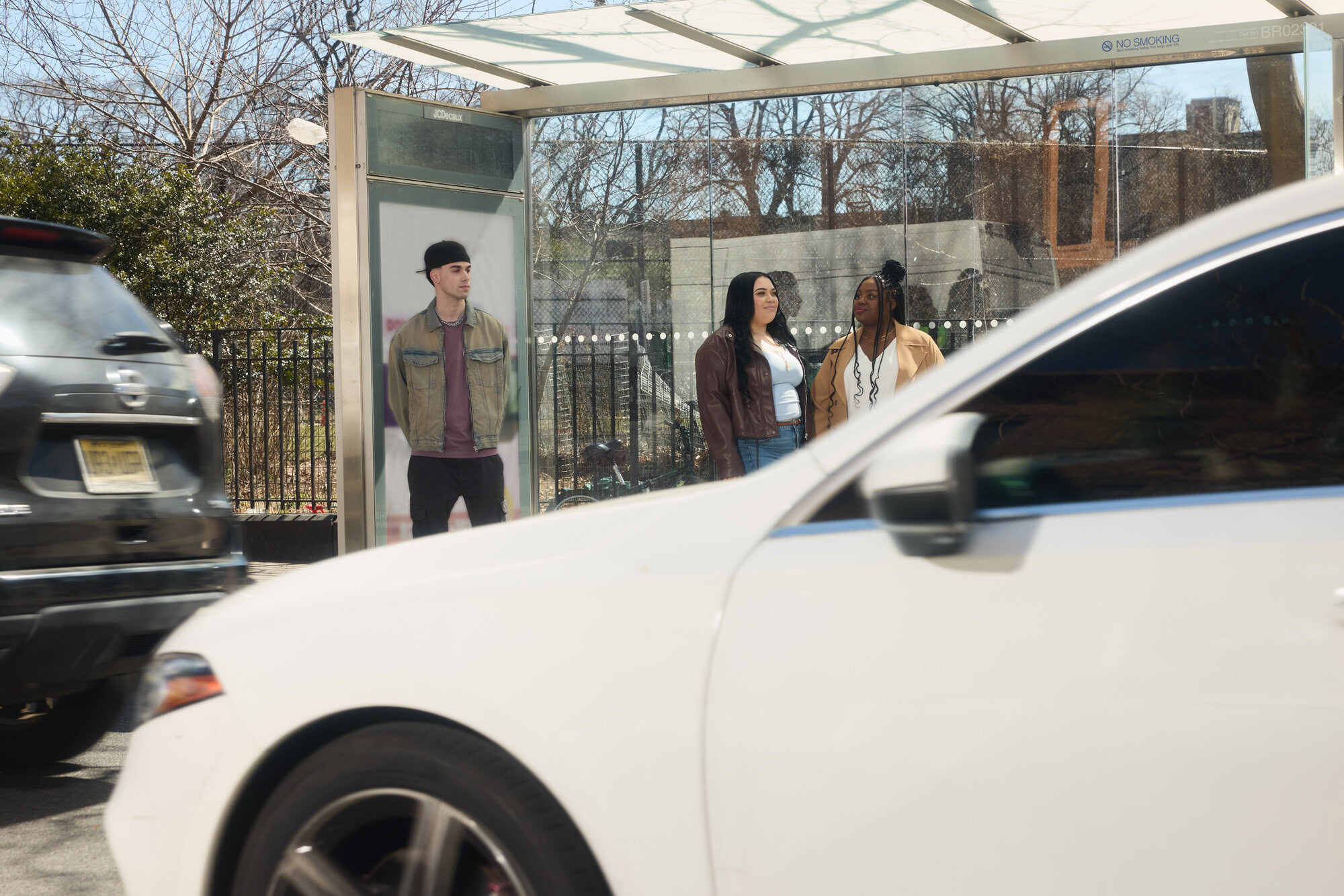 Diverse group of MetroPlusHealth members smiling together outdoors.