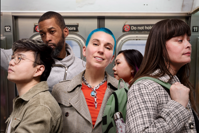 MetroPlusHealth representative helping a member complete Gold Plan enrollment paperwork.