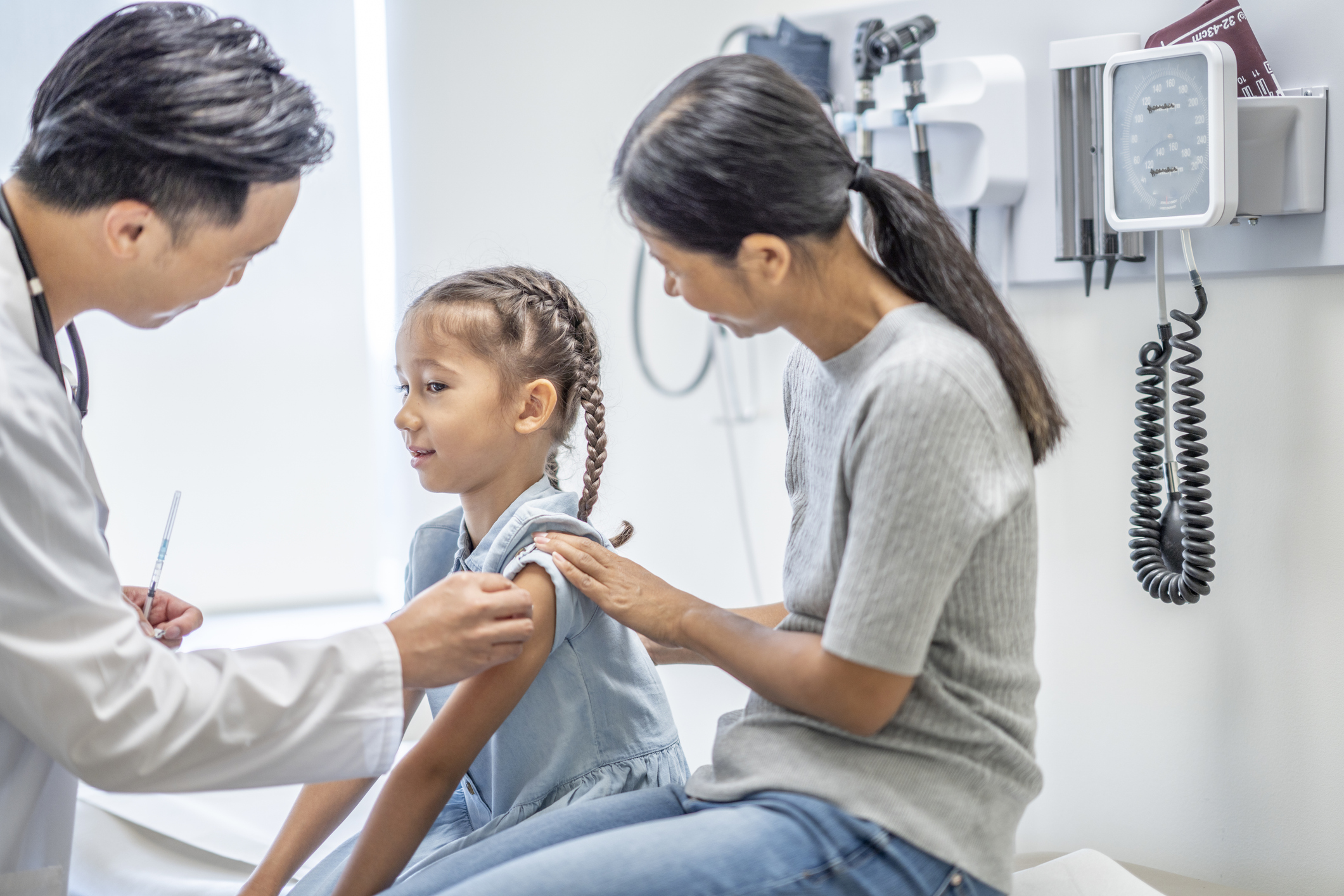 Member receiving a reward gift card for completing preventive care through MetroPlusHealth’s Member Rewards Program in New York City.