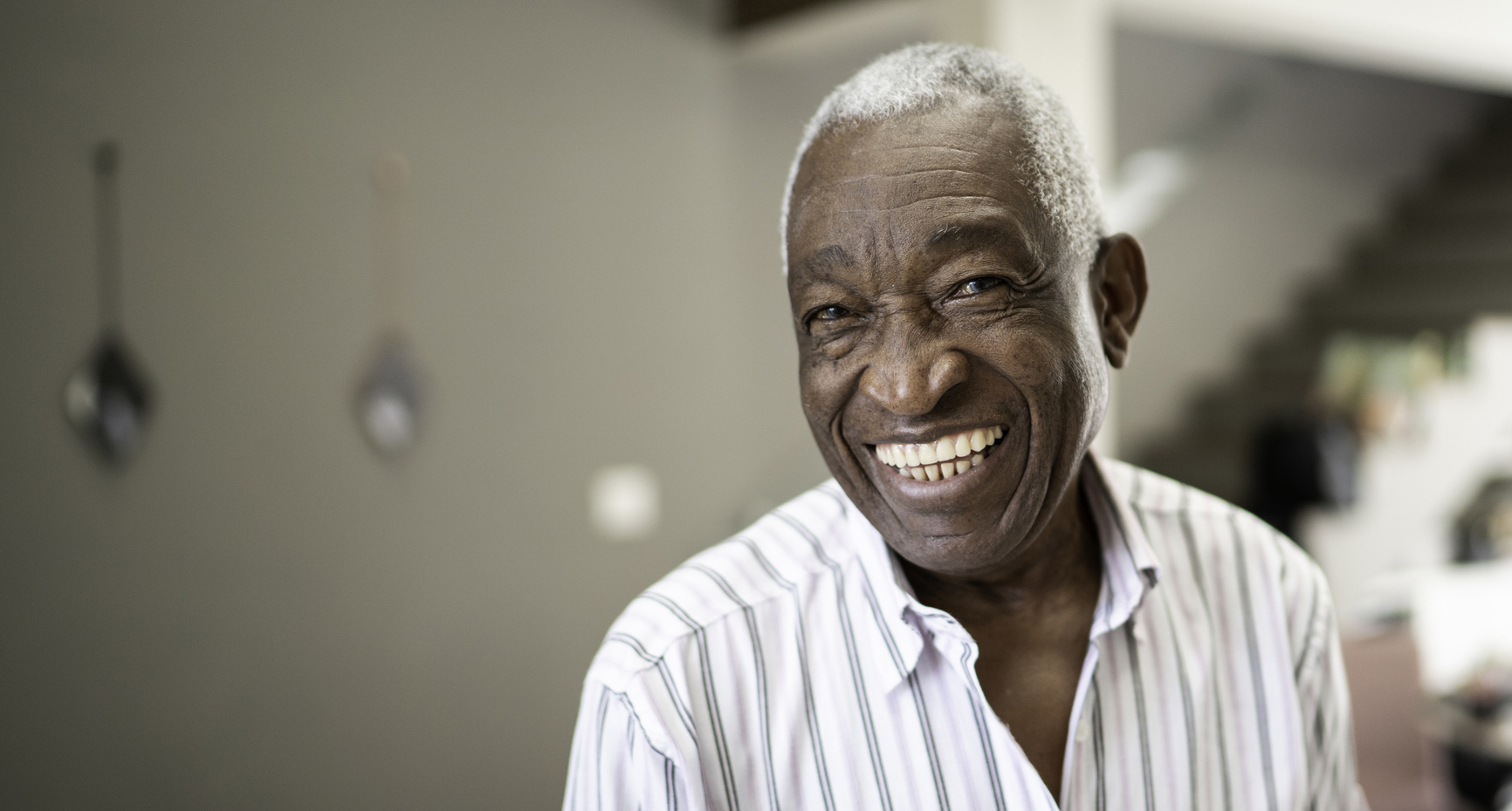 Doctor smiling with senior patient, representing MetroPlusHealth Medicare Advantage Plan in New York City.