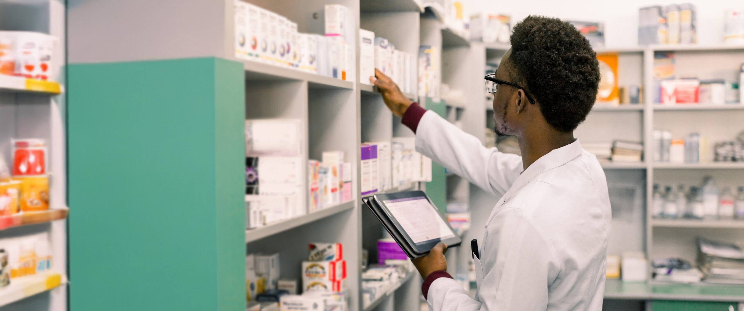 Healthcare professional reviewing pharmacy policies and medication coverage guidelines for MetroPlusHealth providers.